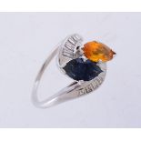 A sapphire, orange sapphire and diamond ring
