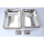 A pair of electro-plated rectangular entree dishes and covers with matched silver handles