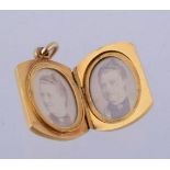 A locket pendant of rectangular form with curved ends