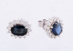 A pair of sapphire and diamond cluster earrings