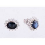 A pair of sapphire and diamond cluster earrings