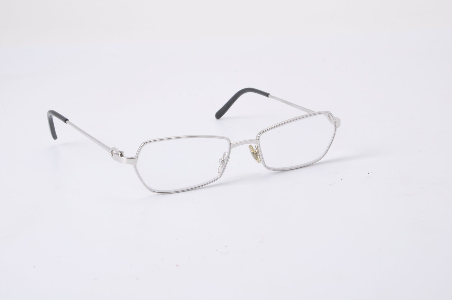 Cartier, a pair of white metal framed glasses