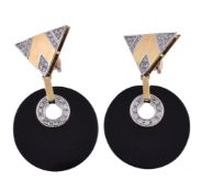 A pair of onyx and diamond earrings