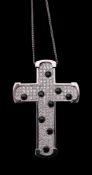 A diamond and onyx cross pendant