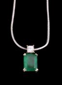 An emerald and diamond pendant