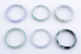 A collection of six jadeite bracelet bangles