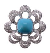 A turquoise and diamond flower head ring