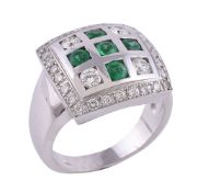 An emerald and diamond ring