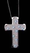 A diamond and turquoise cross pendant