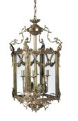 A pair of gilt metal and glazed hall lanterns in Louis XVI taste