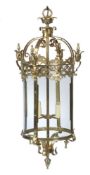 A matched pair of gilt metal and glazed circular hall lanterns