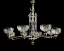 An Edwardian cut and moulded glass and silver plated metal mounted eight light gasolier by F & C Osl