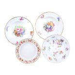 A group of four Derby porcelain plates