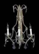 A pair of Continental, probably Italian, gilt metal and glass three light wall appliques in 18th cen