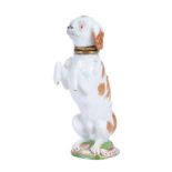 A Meissen scent bottle and stopper modelled a begging spaniel