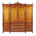 ϒ An Edwardian satinwood, tulipwood, and rosewood banded wardrobe, in George III style,