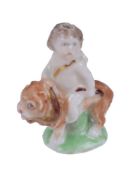 A Charles Gouyn St. James's factory type miniature model of a putto with lion