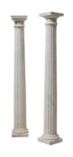 A pair of white marble columnar plinths