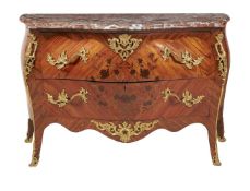 ϒ A kingwood, tulipwood inlaid, and gilt metal mounted commode in Louis XV style