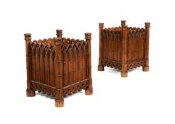 A pair of George III style chestnut jardinieres, in the Gothic style