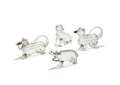 Four various clear glass novelty spirit flasks modelled as animals, late 19th or 20th century