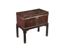 A George III embossed leather chest, late 18th century, on later stand