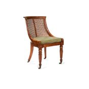 A William IV bird's eye maple and caned bergere