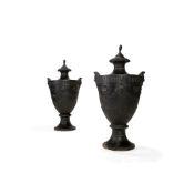 A pair of Scottish George III cast iron stoves modelled as Neoclassical urns, attributed to the Carr