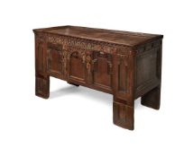 A 17th century style carved oak coffer