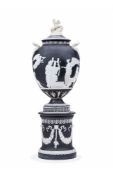 A large Wedgwood black-dip Jasper two-handled 'Pegasus' urn, cover and plinth base, late 19th centur
