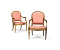 A pair of Louis XVI style giltwood and upholstered armchairs, early 20th century