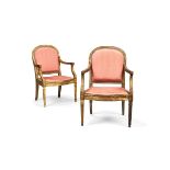 A pair of Louis XVI style giltwood and upholstered armchairs, early 20th century