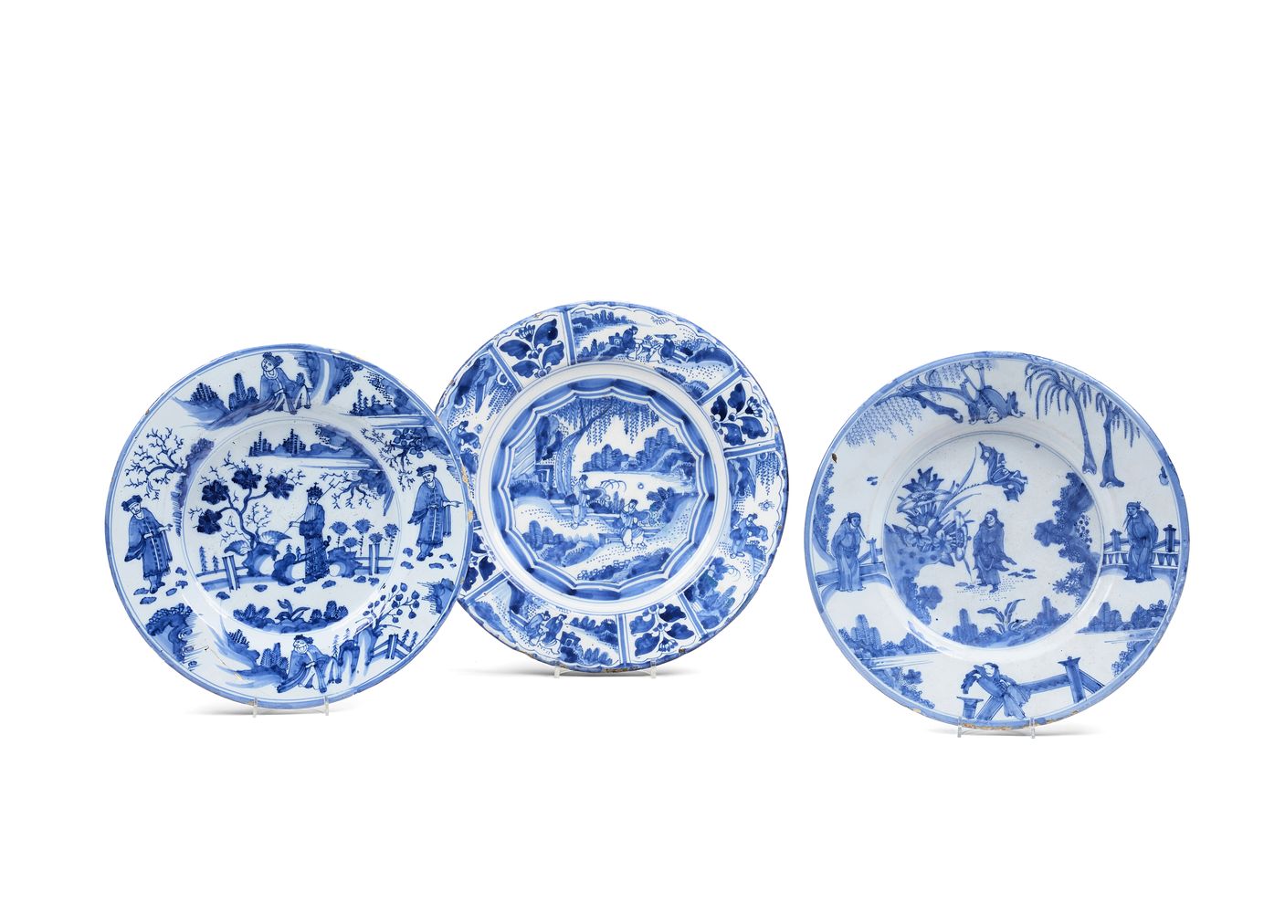 Three Dutch Delft/North German fayence blue and white chargers decorated in the Transitional style,