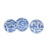 Three Dutch Delft/North German fayence blue and white chargers decorated in the Transitional style,