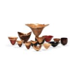 λ Bert Marsh (British, 1932-2011), a collection of thirteen various turned wood vessels