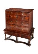 A Queen Anne and later, figured walnut chest on stand