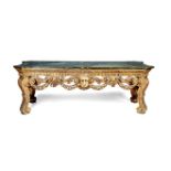 A large George II style carved giltwood side table, circa 1900, in the manner of William Kent