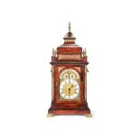 ϒ An impressive gilt brass mounted amboyna musical table clock, the movement and dial by Ellicott