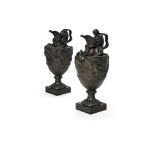 A pair of Wedgwood black basalt wine ewers emblematic of Water and Wine, late 19th century