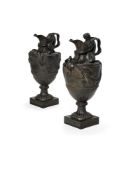 A pair of Wedgwood black basalt wine ewers emblematic of Water and Wine, late 19th century