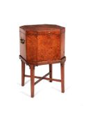 ϒ A George III Amboyna octagonal wine cooler, on a padouk stand