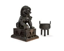A Chinese bronze Buddhist lion on stand, Qing Dynasty, 19th century
