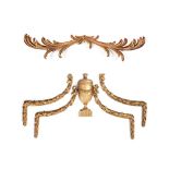 A set of four carved and giltwood wall mounts, 18th century and later