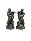 A pair of Wedgwood black basalt Triton candlesticks, late 18th or early 19th century