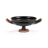 An Attic black glazed stemmed kylix, 5th Century B.C.