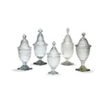 Five various cut-glass urns and covers or bonbonieres in the Regency style, 37cm high and smaller, l