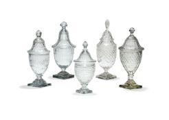 Five various cut-glass urns and covers or bonbonieres in the Regency style, 37cm high and smaller, l