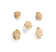 A group of five Gandhara stucco heads