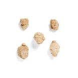 A group of five Gandhara stucco heads