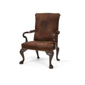 A George II style stained walnut library armchair, early 20th century